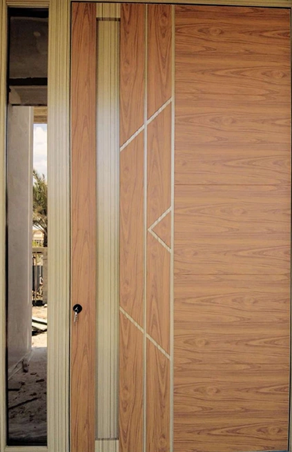 A wood-tone entrance with fine vertical and angular decorative lines and a narrow glazed side panel.