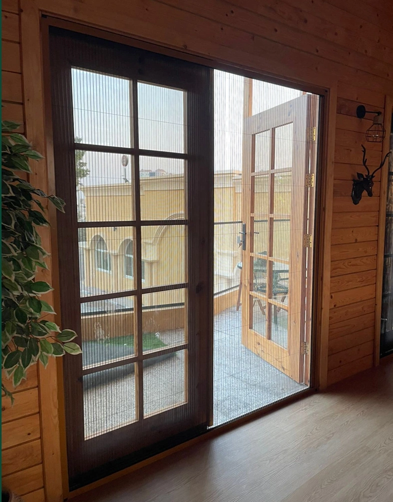 A framed sliding glass-door arrangement connecting an interior to an outdoor space.
